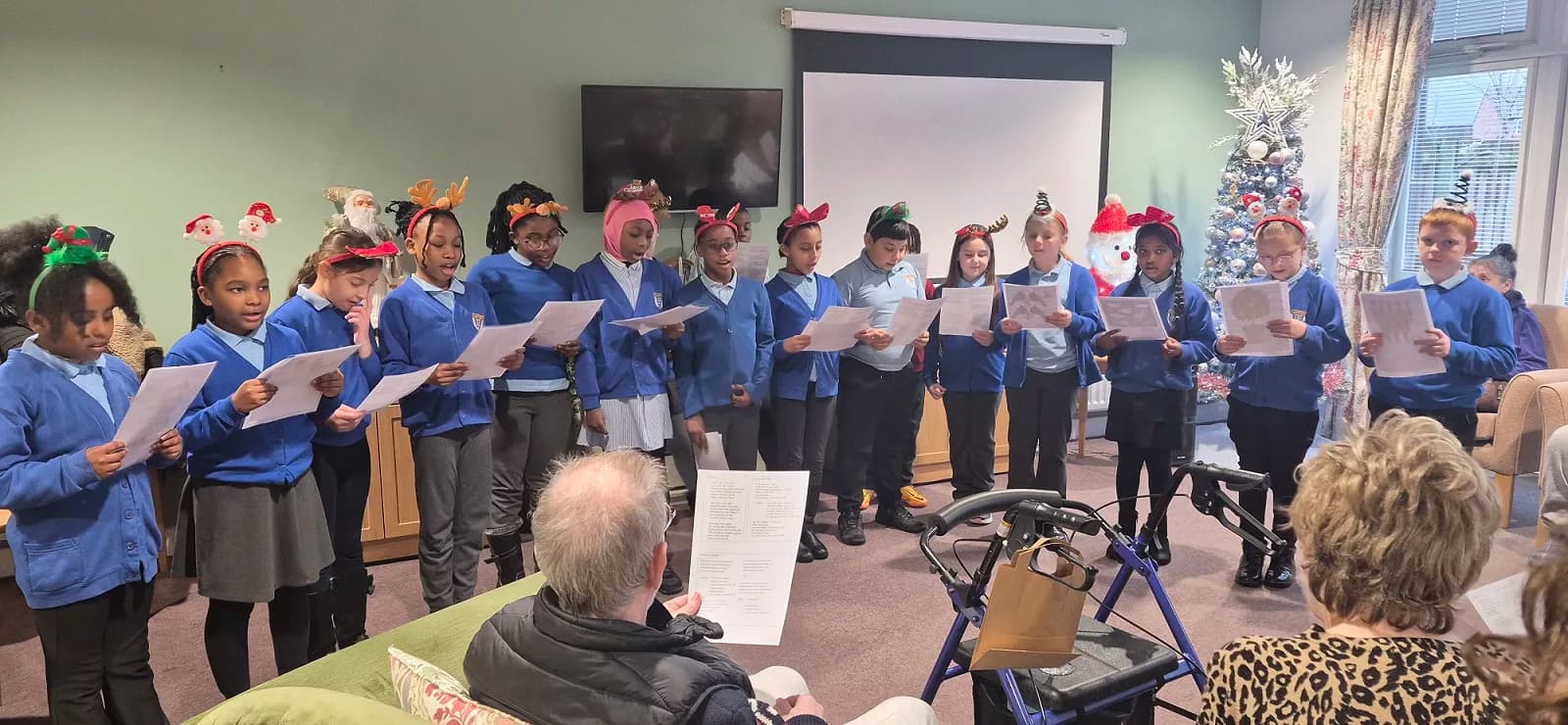 Christmas Carols and Kindness as Young Voices Brighten Care Home in Walker