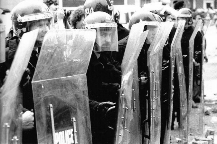 Riot police with shields during the miners' strike