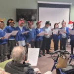 Christmas Carols and Kindness as Young Voices Brighten Care Home in Walker
