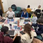 Children take part in a hands-on workshop, creating their own model galaxies as part of the learning experience.